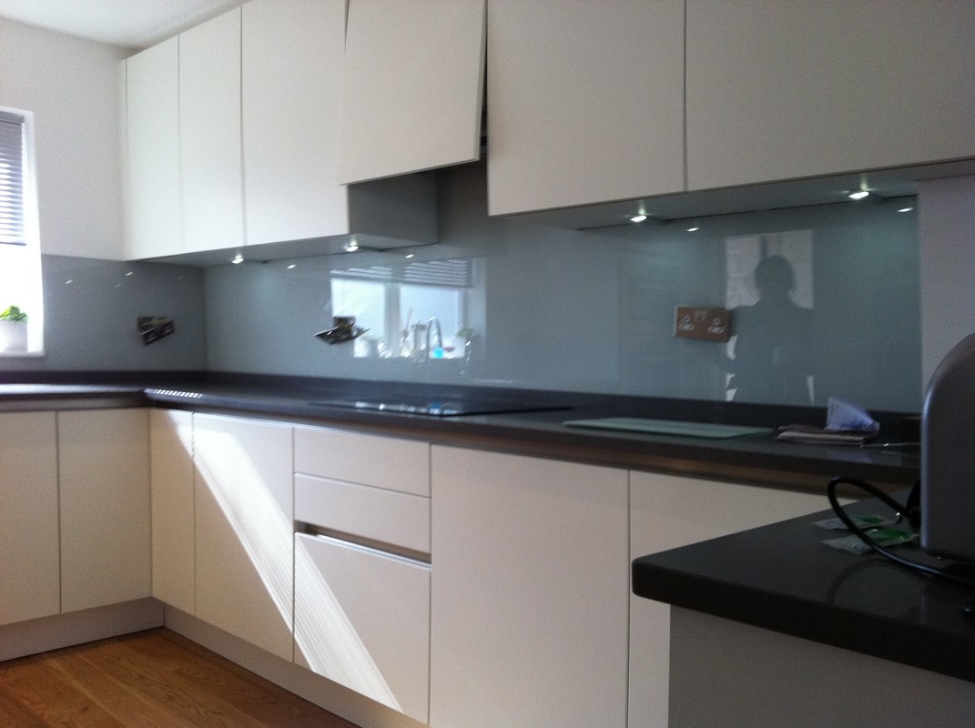 Grey glass kitchen splashback with LED lighting in West Drayton