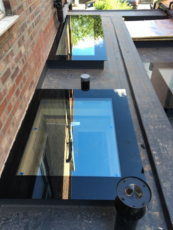 Multiple flat roof skylights on extension in West Drayton