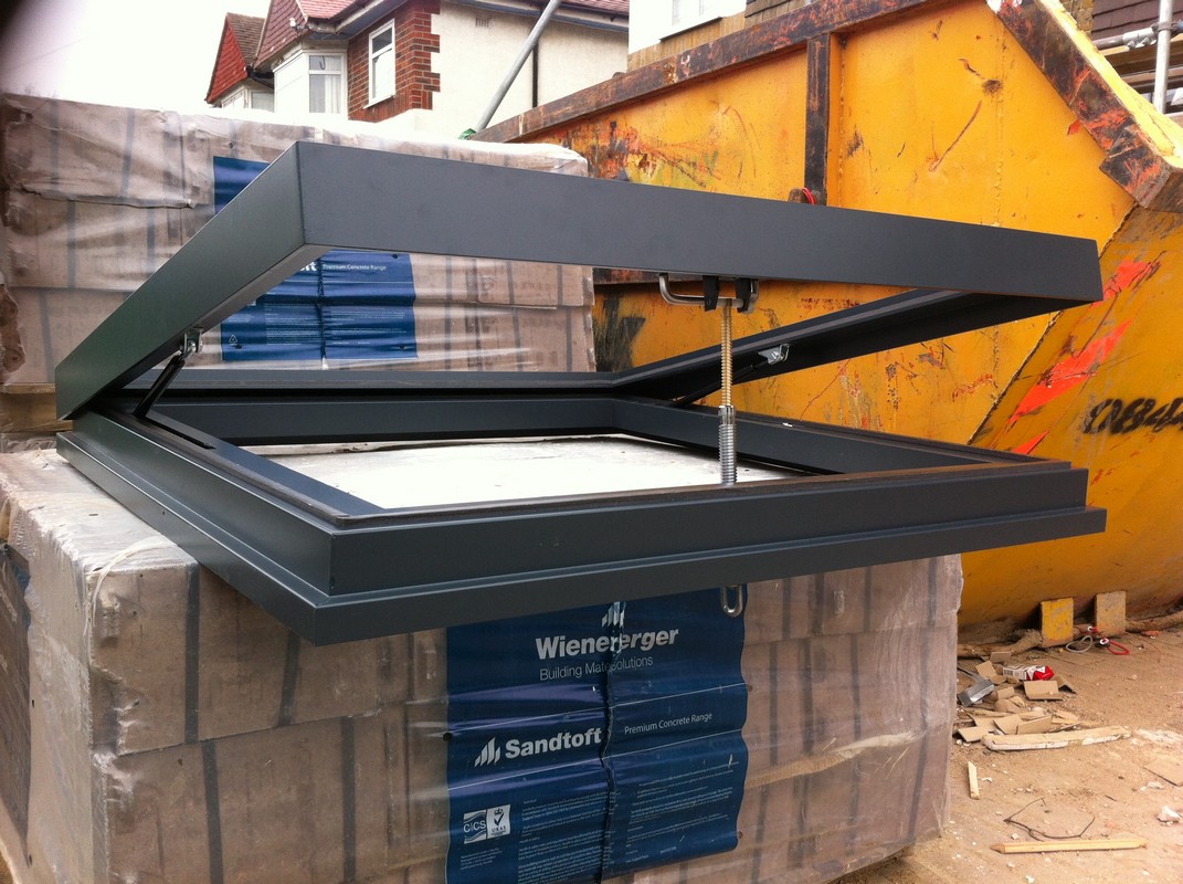 Opening flat roof skylight in anthracite grey installed in West Drayton