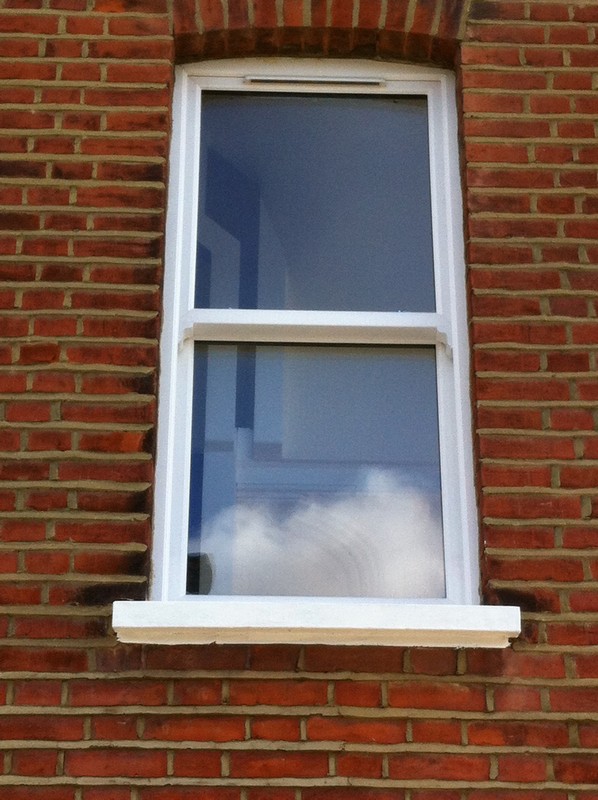 uPVC sash window on Victorian red brick house in West Drayton